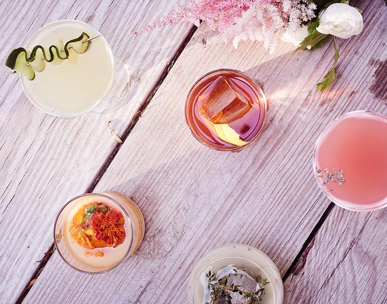 Arial View of Various Drinks on Wooden Table | David's Bridal